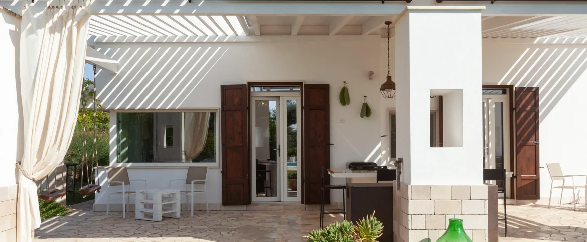Ergonomic executive desk setup with a garden view inside Villa Mia, illustrating the high-tech standards of the best remote work villas Italy.